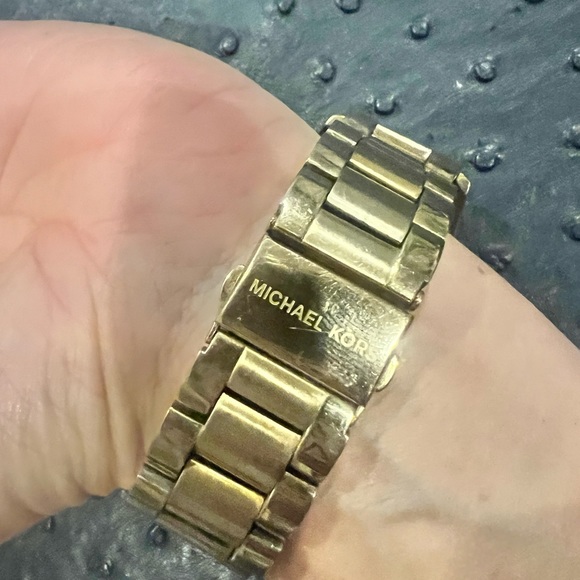 Used Michael Kors gold watch with blue background and map diamonds. - Picture 2 of 4